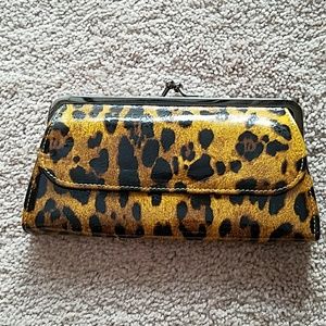 Cheetah print patent clutch.