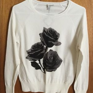Sweater with flower appliqué