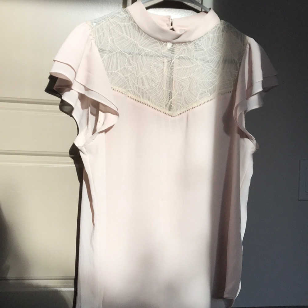 Blush colored women’s blouse. Lace front.
