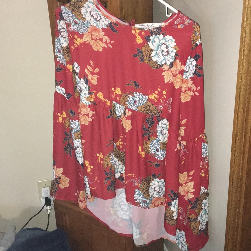Brand new Long sleeve floral open/tie back top