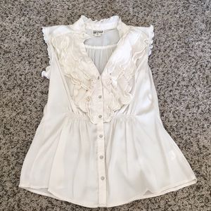 Sleeveless cream colored button up