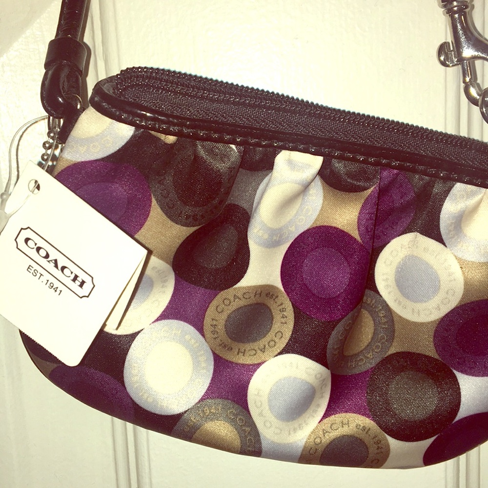 Purple multi color Coach zipper clutch/wallet. NWT