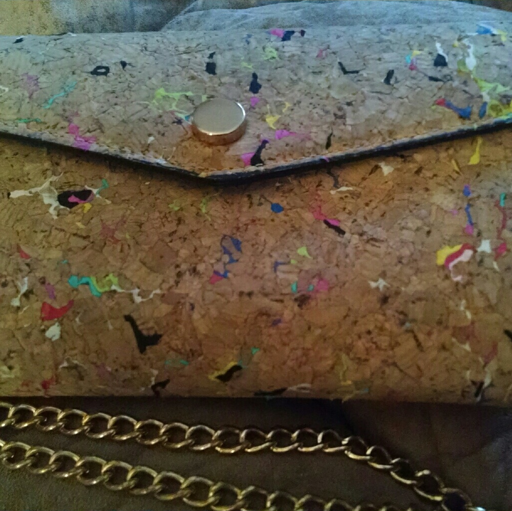Clutch with detachable gold strap.
