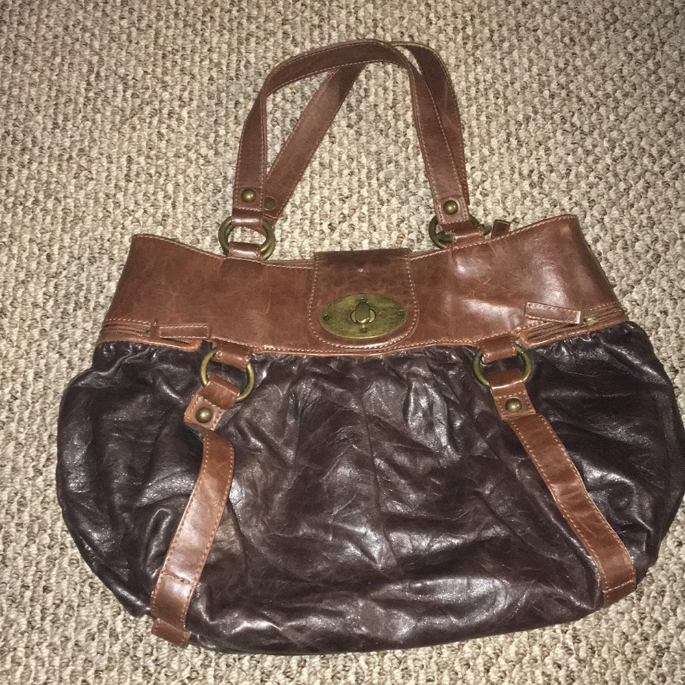 Brown leather front clasp side zipper tote