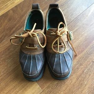 Brown leather and rubber rain boots