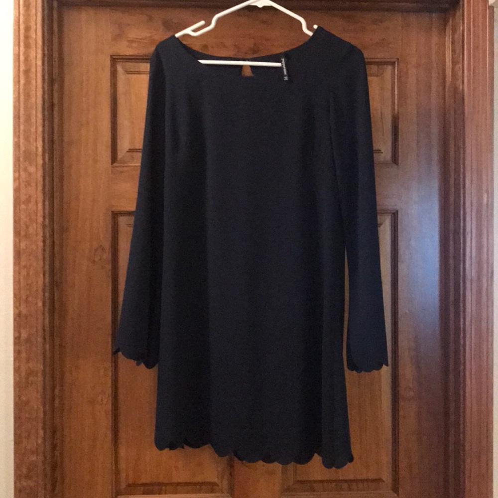 Navy long sleeve dress. Peddled trim