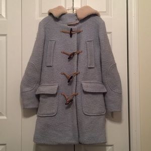 Long blue coat with toggle buttons