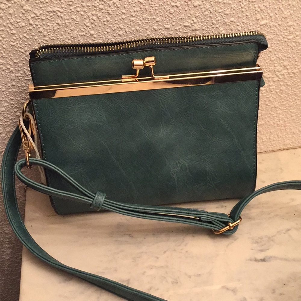 Cross-body purse with gold details!