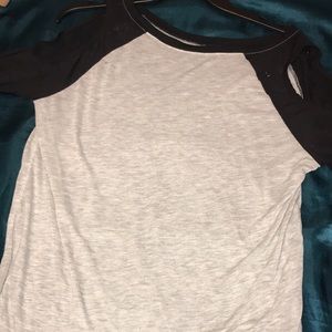 Grey top, with cut out sleeves.