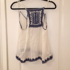 white open back shirt with blue detail