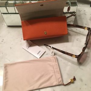 Tory Burch sunglasses.