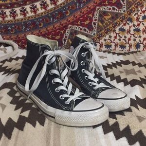 Black and white hightop converse