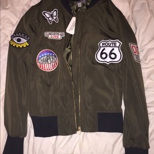 Brand new patched green bomber jacket