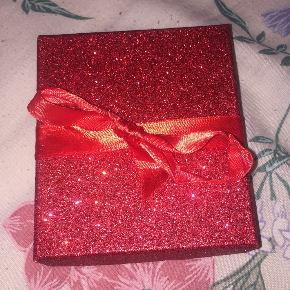 A Bracelet With 2 Charms Infinity, And A High Heel