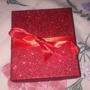 A Bracelet With 2 Charms Infinity, And A High Heel