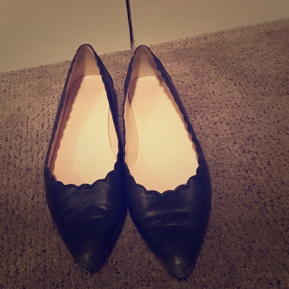 Black leather pointed toed flats