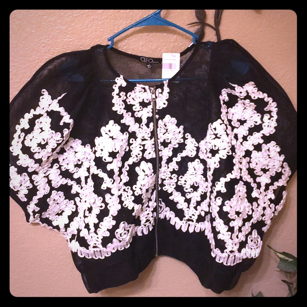 Black little jacket-type blouse with ribbon detail