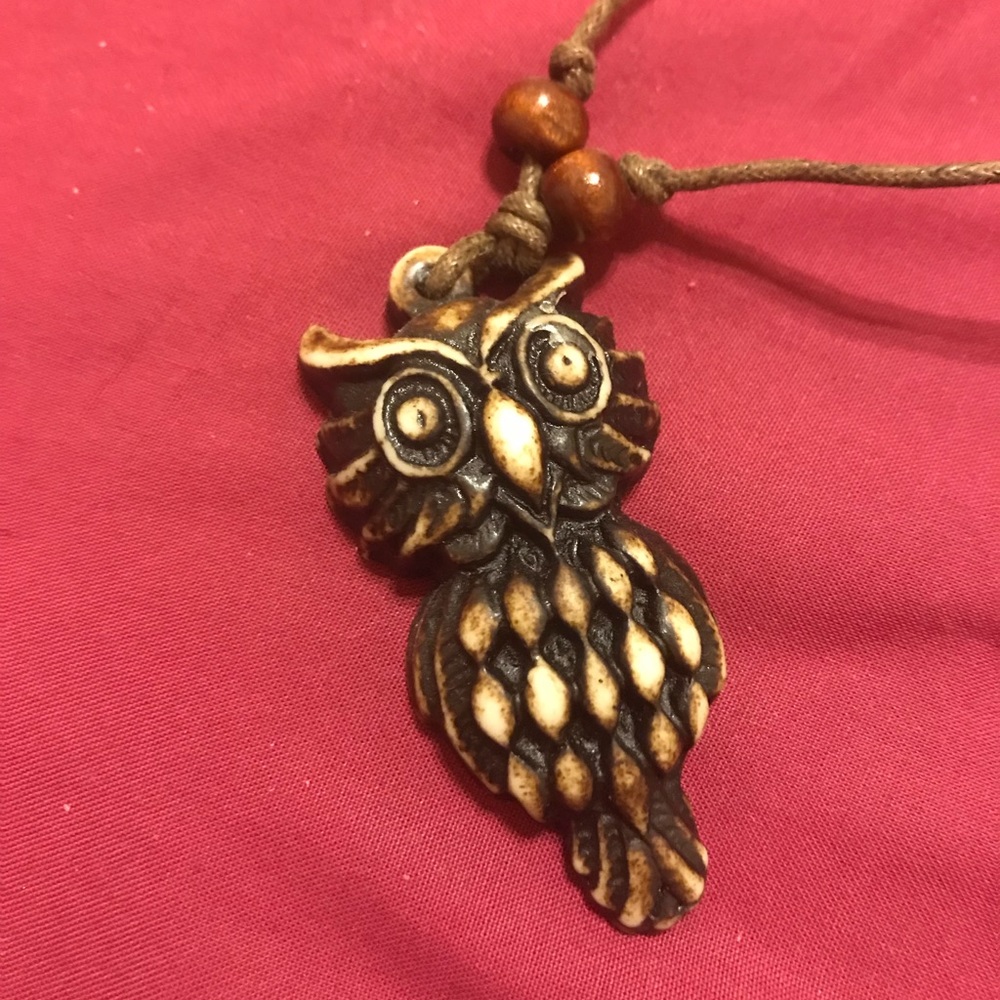 a wooden owl necklace