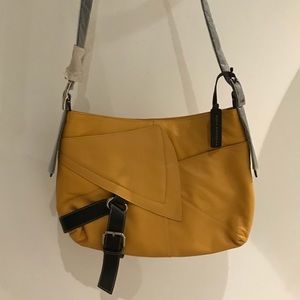New with Tags.  Aqua Madonna cross body Hobo bag
