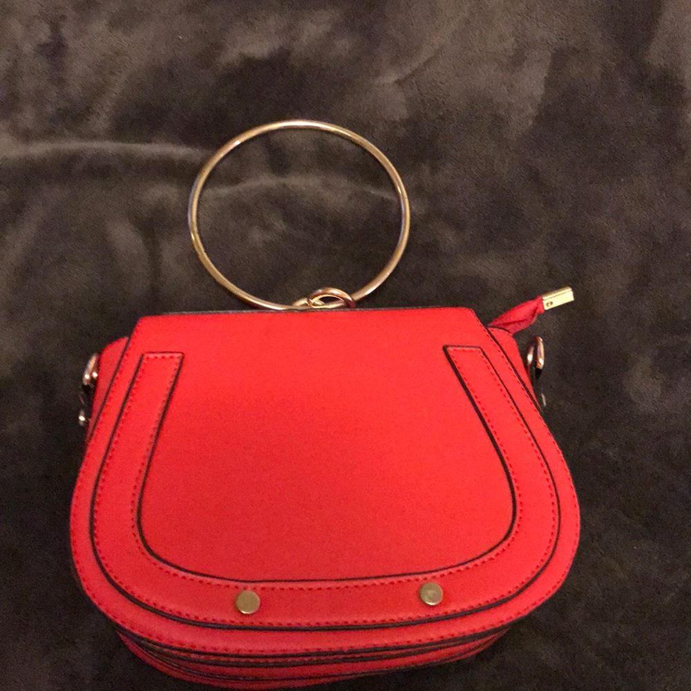 Red crossbody/ ring bag