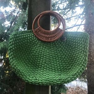 The Sak Original sea green wicker style bag.