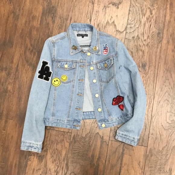 denim jacket with pins and patches