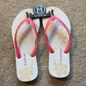 Bebe floral logo flip flops
