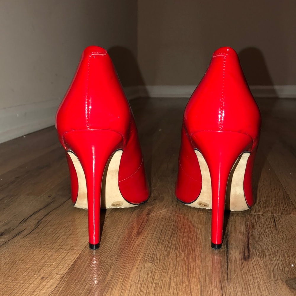 Red heel pumps