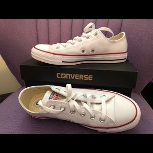 Chuck Taylor white leather converse sneakers.