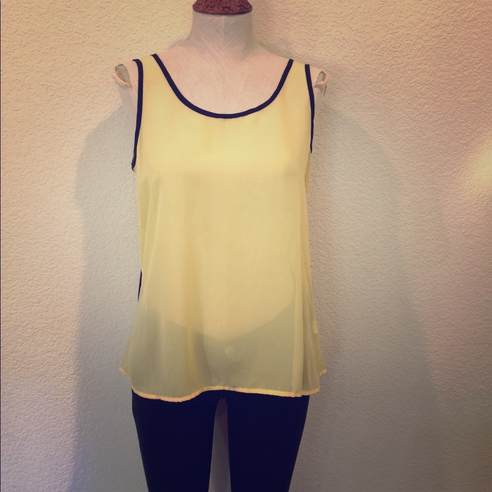 Light yellow sheer blouse with black tie