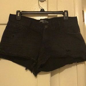 Distressed black jean shorts