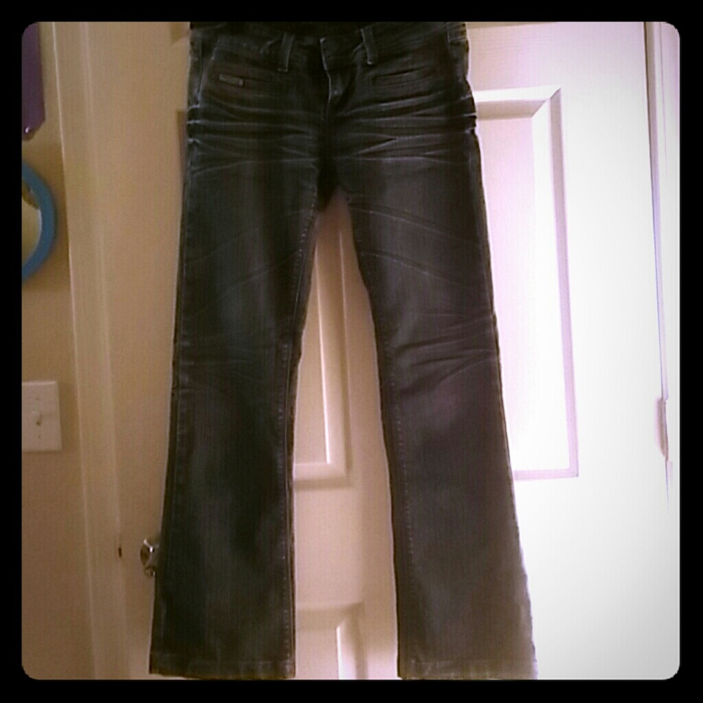 A pair of American Flavour Jeans with crease look.