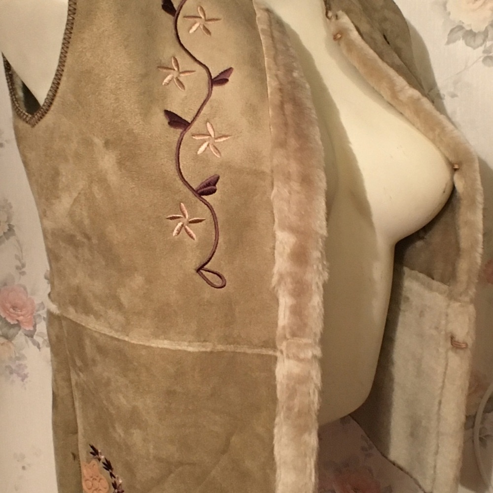 Women’s faux leather and fur embroidered vest.
