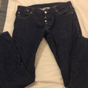 Five FourMark McNairy button fly jeans.