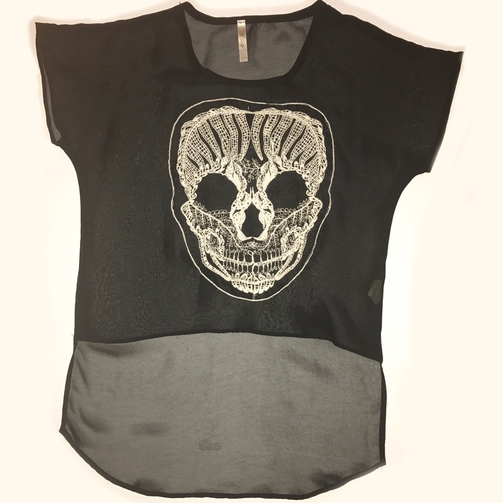 Embroidered skull on a black sheer top