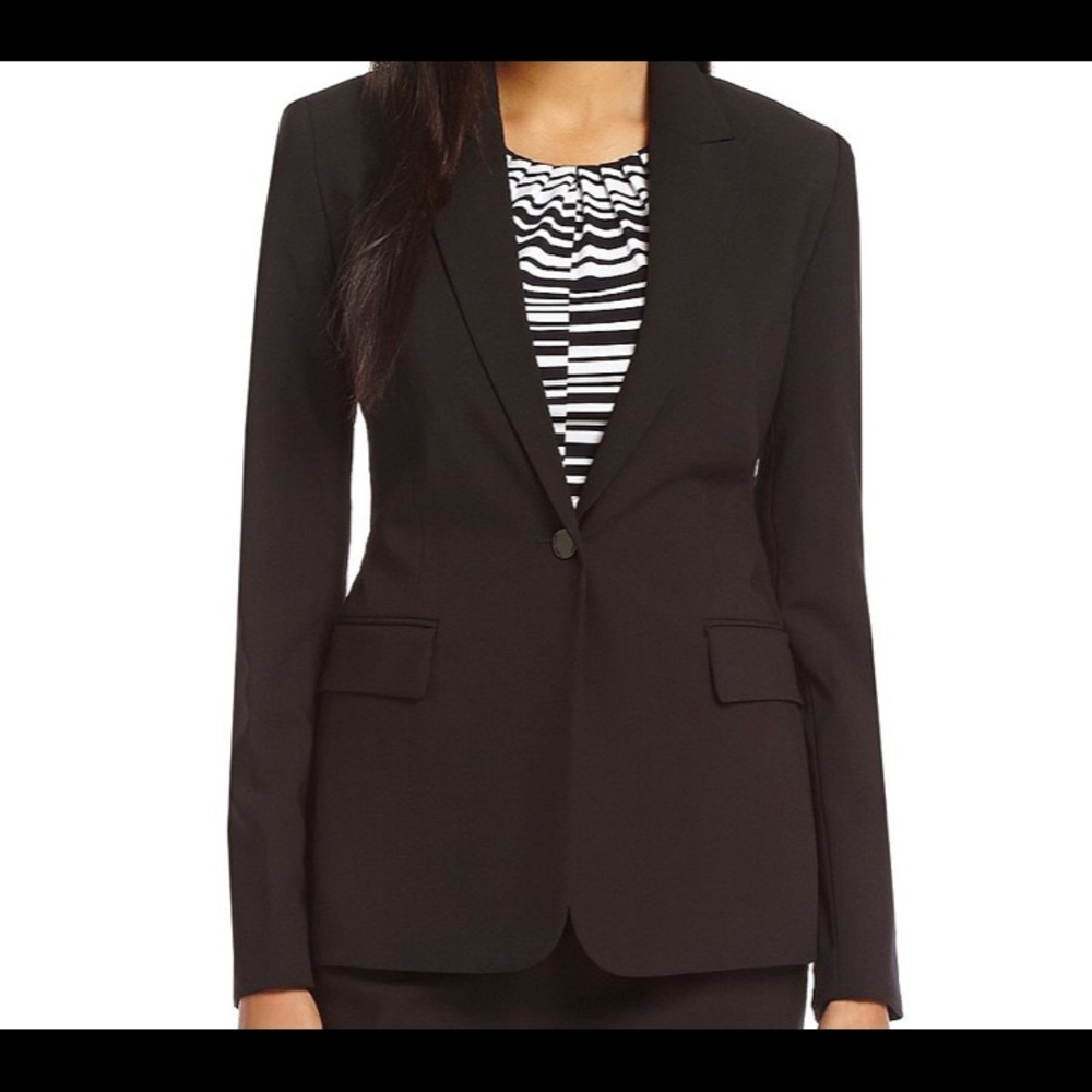 Calvin Klein grey suit. Single button blazer.