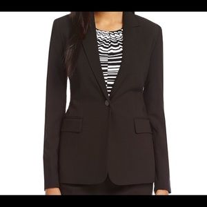 Calvin Klein grey suit. Single button blazer.