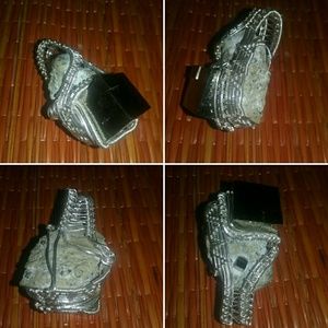 Pyrite wrapped in sterling silver.