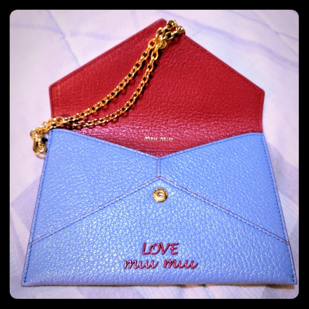 Miu Miu Baby Blue Clutch with gold Strap