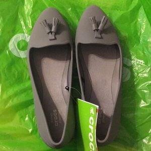 Gray Crocs with tassels