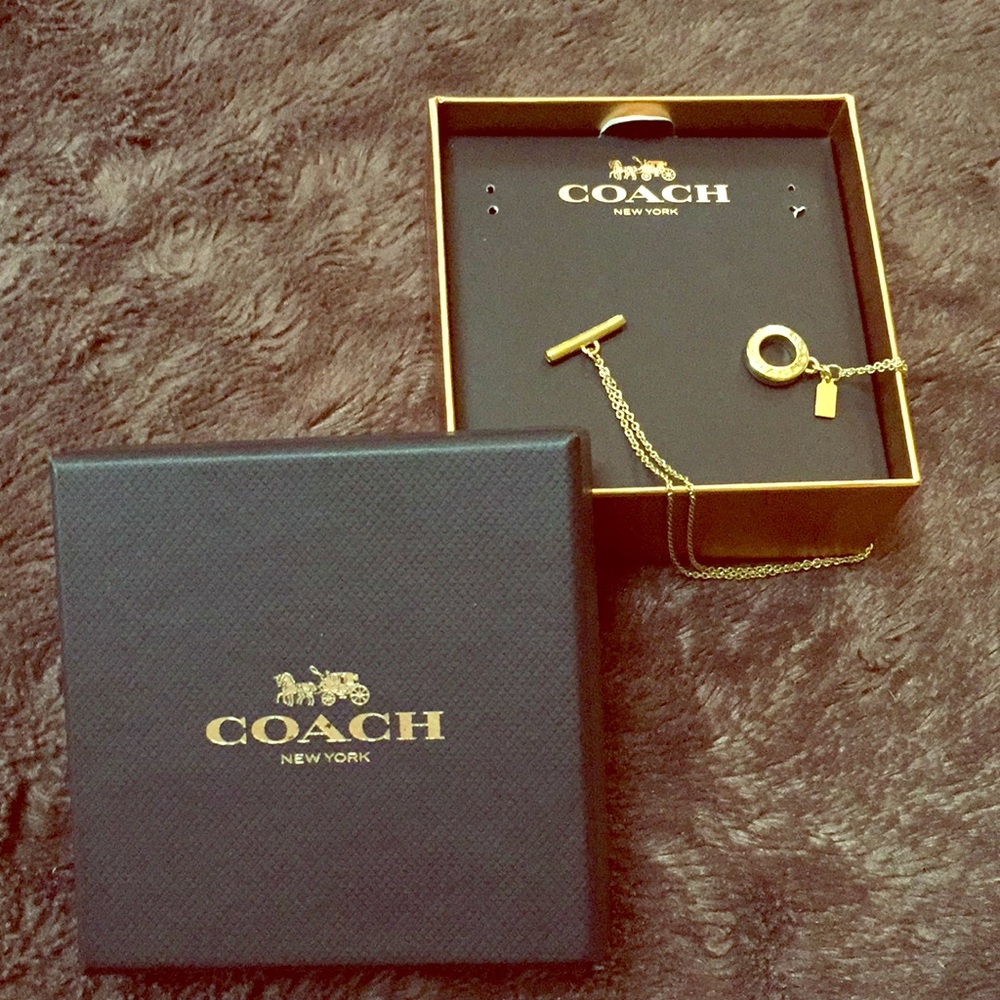 Delicate Gold toned Coach Bracelet