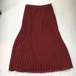 Red pleated maxi skirt