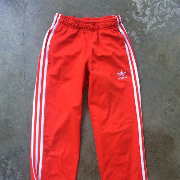 white adidas track pants with red stripes
