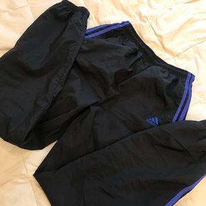 Black adidas pants with blue stripes