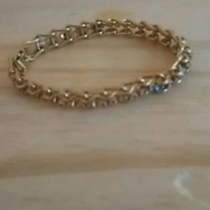 Gold bracelet with rainbow jems