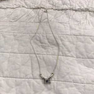 Silver necklace dark blue stone detail