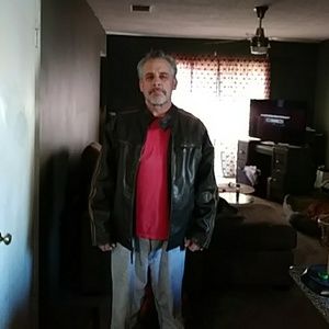 A large mens brown leather jacket