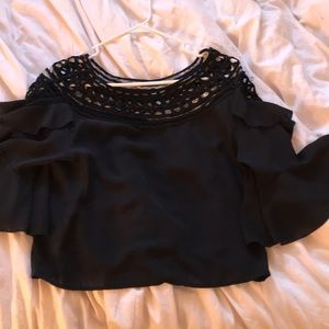 Black fashion top with crocheted pattern on top