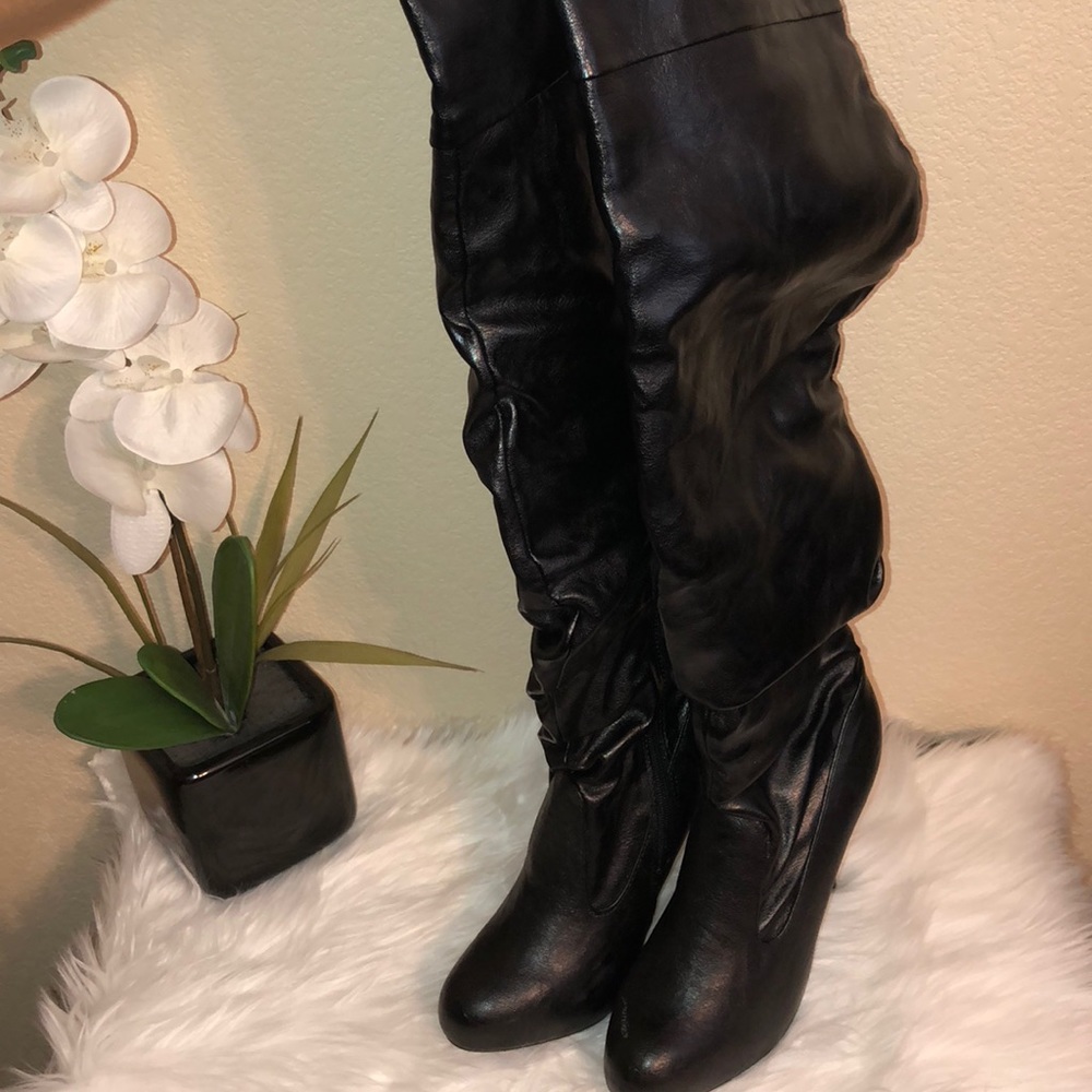 Over the knee high boots with a 4 1/2” heel.