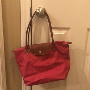 Pink, authentic long champ purse.